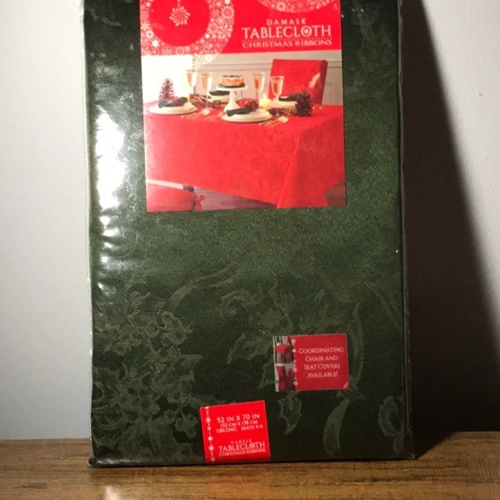 Damask Christmas Ribbon tablecloth. Size 52 x 70 oblong . Color is green